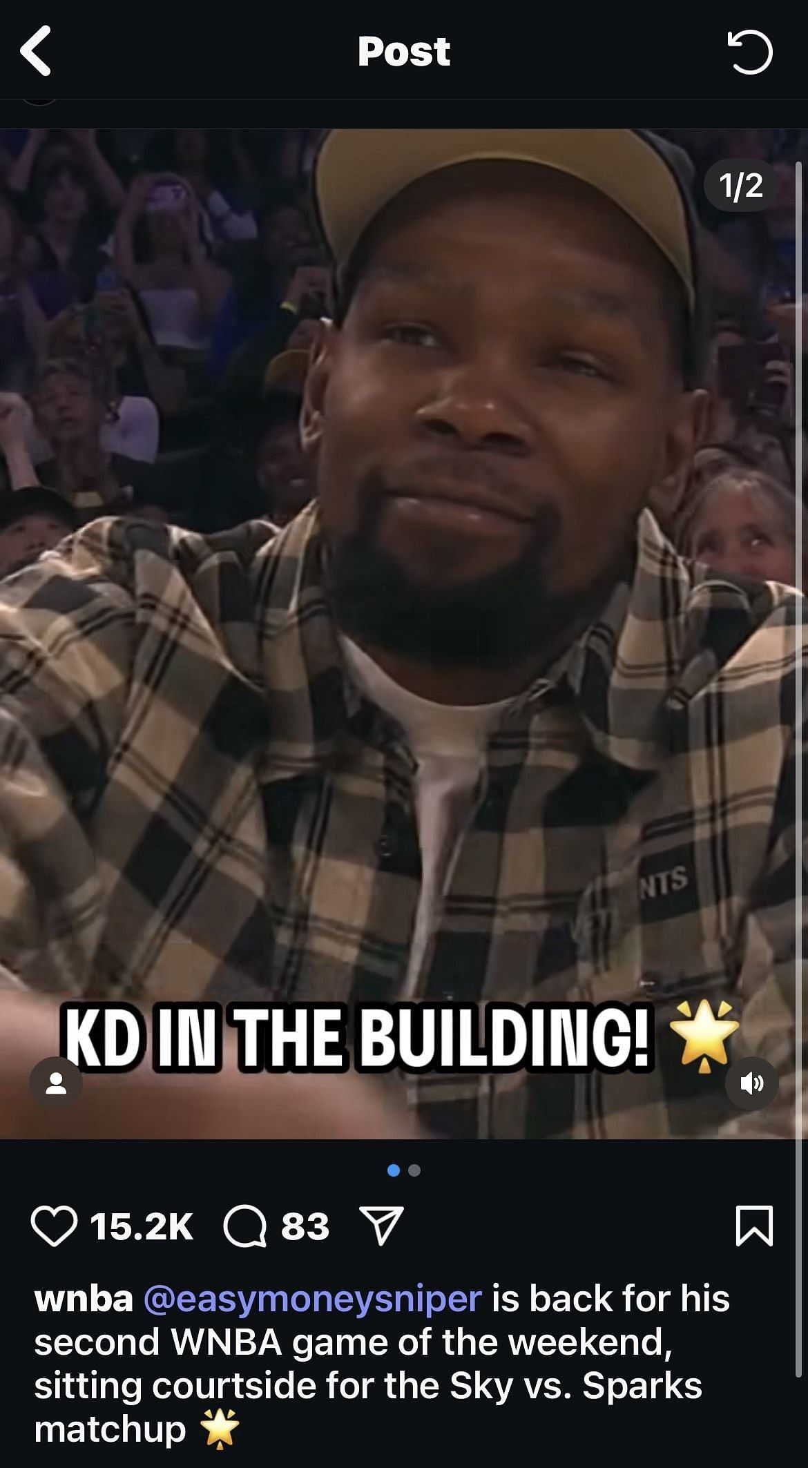 Kevin Durant sits courtside at the Los Angeles Sparks game